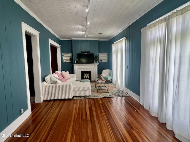 701 Court St, Cleveland, MS 38732 - living area with track lighting, ornamental molding, wood-type flooring, and a fireplace