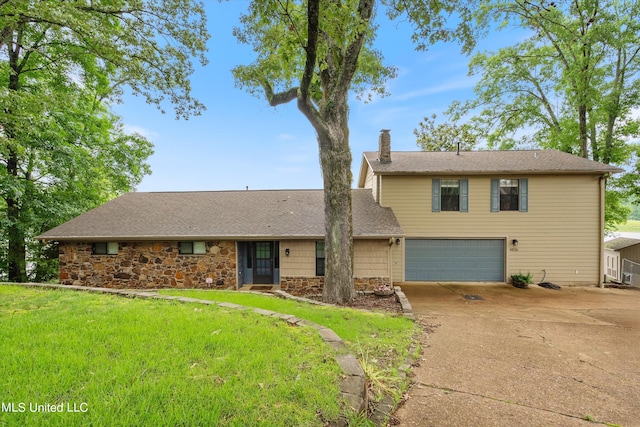 front of property with a garage and a front yard