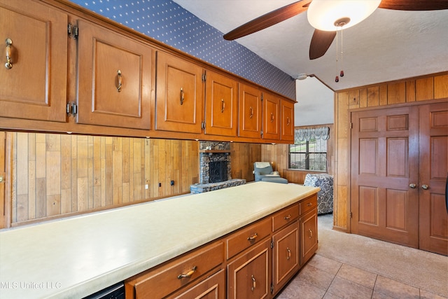 kitchen with light tile patterned floors and ceiling fan