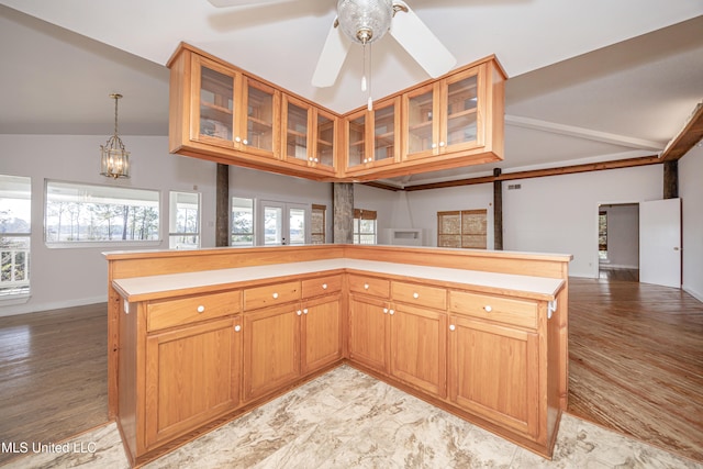 kitchen featuring french doors, ceiling fan with notable chandelier, hanging light fixtures, vaulted ceiling, and light hardwood / wood-style floors