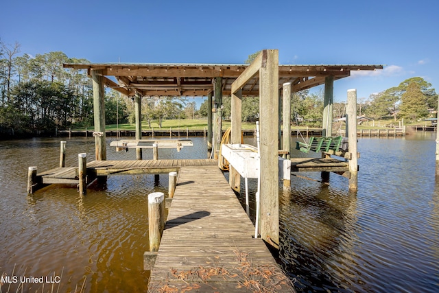 view of dock with a water view