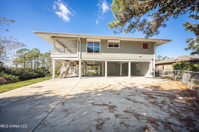 rear view of house featuring a carport