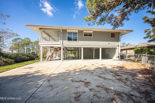 back of house with a carport