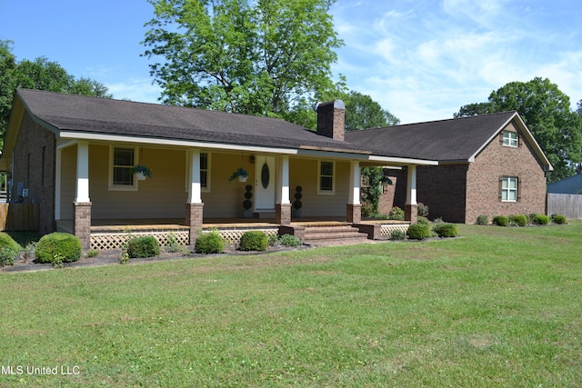 19728 Hwy 63, Moss Point, MS 39562 - view of front of house featuring covered porch, a chimney, and a front lawn