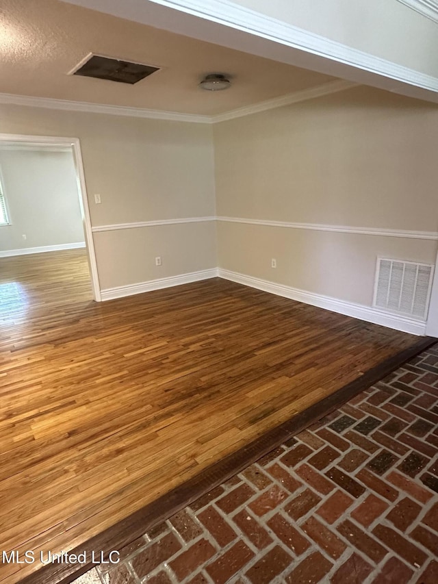 19728 Hwy 63, Moss Point, MS 39562 - unfurnished room with baseboards, ornamental molding, and wood finished floors