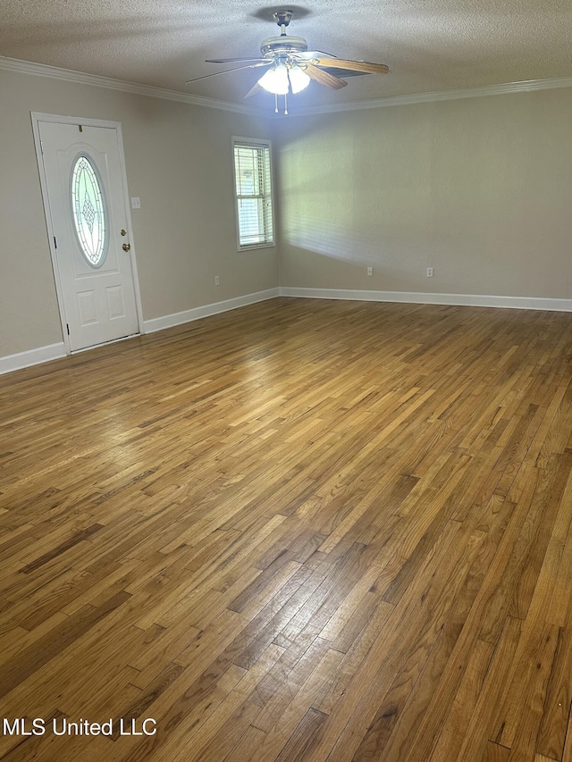19728 Hwy 63, Moss Point, MS 39562 - foyer featuring ceiling fan, hardwood / wood-style floors, a textured ceiling, crown molding, and baseboards