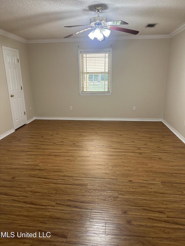 19728 Hwy 63, Moss Point, MS 39562 - spare room with ceiling fan, a textured ceiling, dark wood-type flooring, ornamental molding, and baseboards