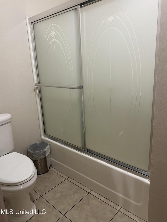 19728 Hwy 63, Moss Point, MS 39562 - full bathroom featuring toilet, tile patterned flooring, and shower / bath combination with glass door
