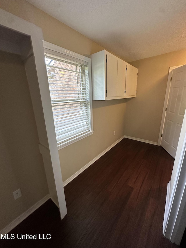 19728 Hwy 63, Moss Point, MS 39562 - interior space featuring dark wood finished floors and baseboards