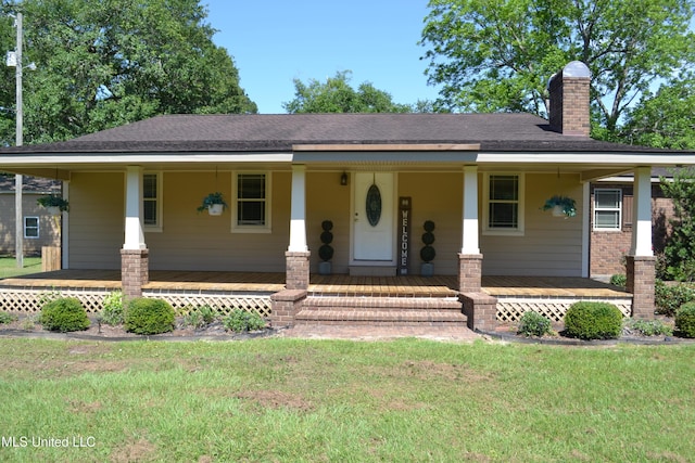 19728 Hwy 63, Moss Point, MS 39562 - view of front facade featuring a porch, a front lawn, and a chimney