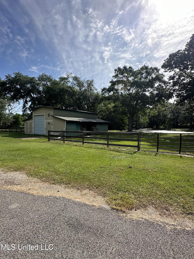 19728 Hwy 63, Moss Point, MS 39562 - view of yard with a garage, an outbuilding, and driveway