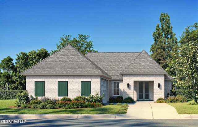 10875 Lily Ln, Gulfport, MS 39503 - view of front facade with french doors, brick siding, a front lawn, and a shingled roof