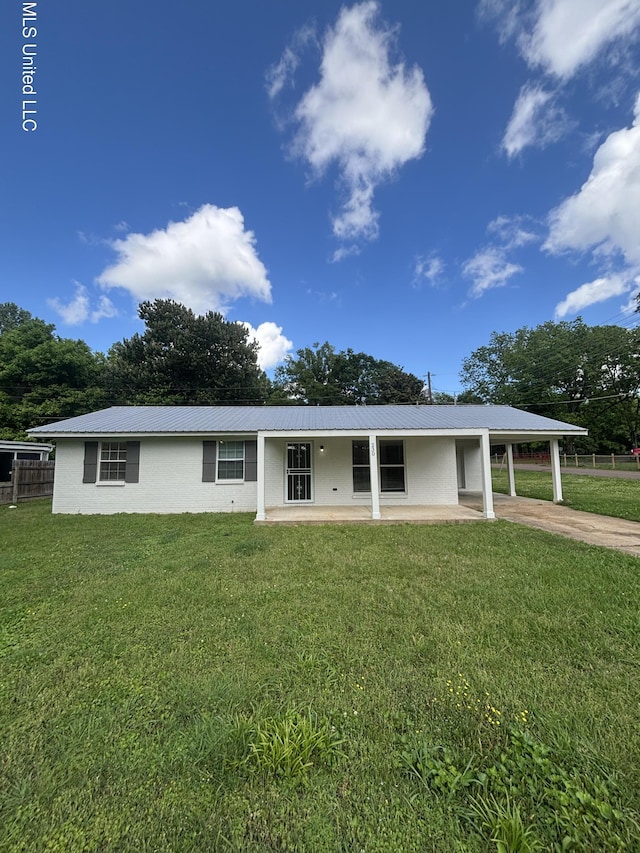 230 Greenbriar Cir, Holly Springs, MS 38635 - back of house with a carport, concrete driveway, and metal roof