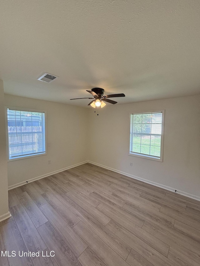 230 Greenbriar Cir, Holly Springs, MS 38635 - unfurnished room with wood finished floors, a ceiling fan, and baseboards