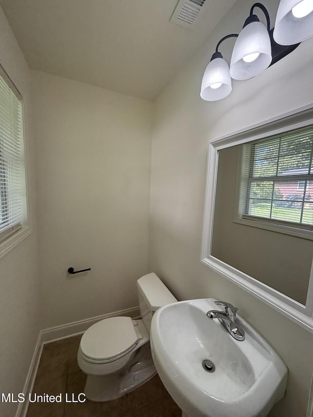230 Greenbriar Cir, Holly Springs, MS 38635 - bathroom with a sink, toilet, tile patterned flooring, and baseboards