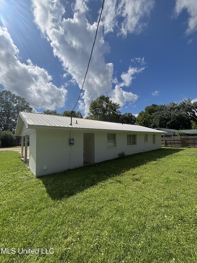 230 Greenbriar Cir, Holly Springs, MS 38635 - back of house with metal roof and brick siding