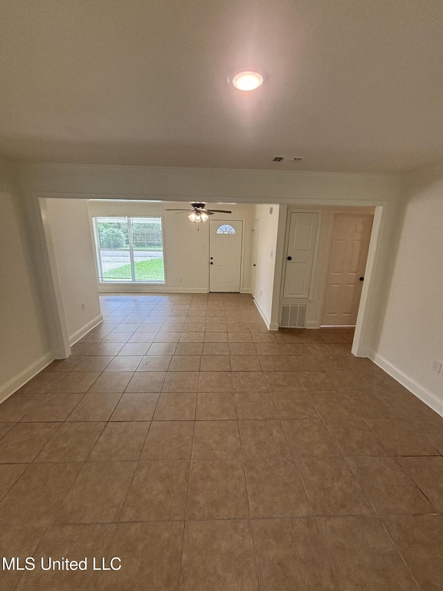 230 Greenbriar Cir, Holly Springs, MS 38635 - unfurnished room with ceiling fan, tile patterned floors, and baseboards