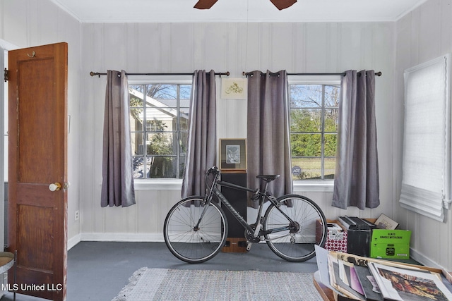 interior space with ceiling fan and a healthy amount of sunlight