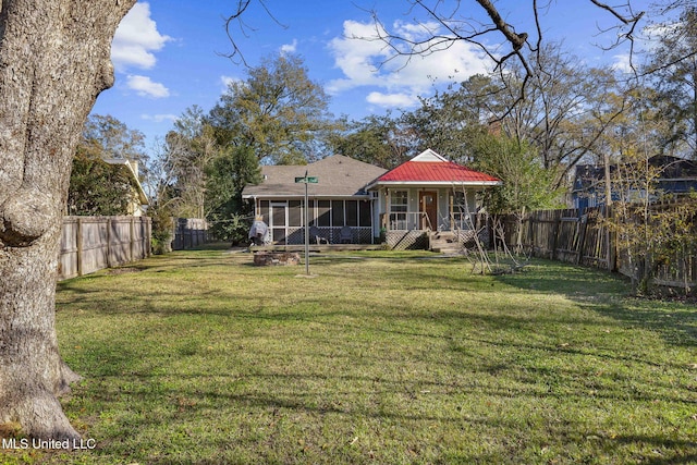 view of yard with a sunroom and covered porch