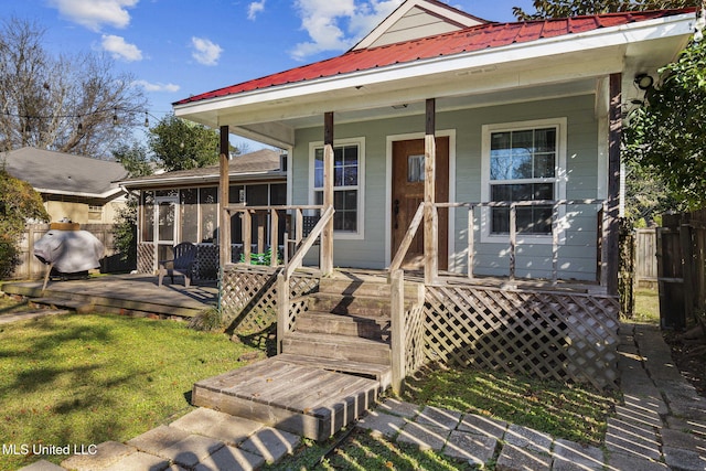 exterior space with a front lawn and covered porch