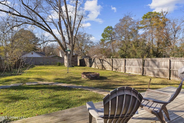 view of yard with an outdoor fire pit and a wooden deck