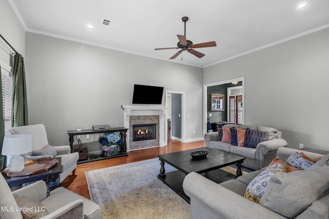 101 Marion Dr, Clinton, MS 39056 - living area with a ceiling fan, wood finished floors, crown molding, recessed lighting, and a lit fireplace