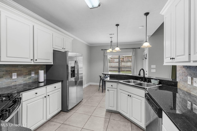 101 Marion Dr, Clinton, MS 39056 - kitchen featuring a sink, appliances with stainless steel finishes, white cabinetry, backsplash, and crown molding