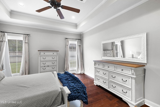 101 Marion Dr, Clinton, MS 39056 - bedroom with a tray ceiling, multiple windows, crown molding, dark wood-style flooring, and baseboards