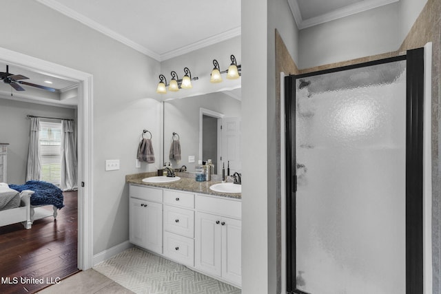 101 Marion Dr, Clinton, MS 39056 - ensuite bathroom with crown molding, double vanity, a shower stall, and baseboards
