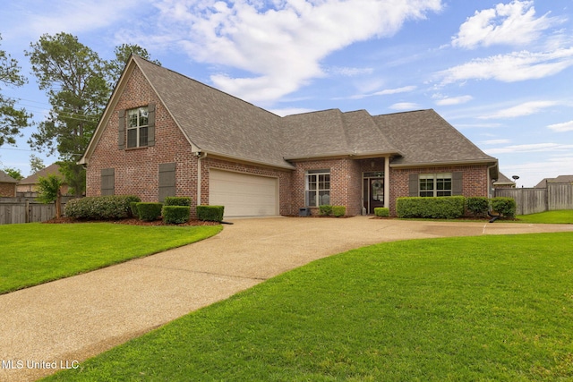 101 Marion Dr, Clinton, MS 39056 - view of front of home with roof with shingles, brick siding, concrete driveway, and a garage