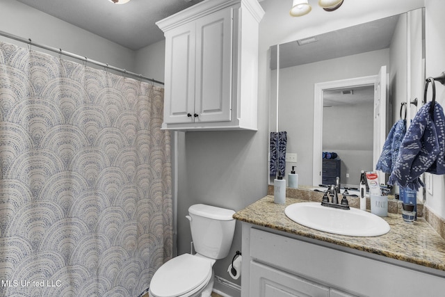 101 Marion Dr, Clinton, MS 39056 - bathroom featuring vanity, toilet, and a shower with shower curtain