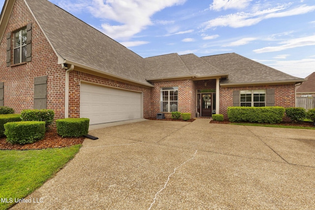 101 Marion Dr, Clinton, MS 39056 - view of front of property with a shingled roof, brick siding, and driveway