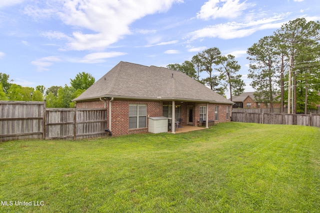 101 Marion Dr, Clinton, MS 39056 - rear view of property featuring brick siding, a patio, and a shingled roof