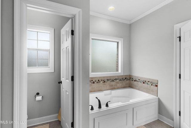 101 Marion Dr, Clinton, MS 39056 - full bathroom featuring a garden tub, crown molding, and baseboards