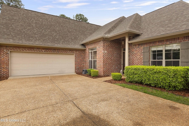101 Marion Dr, Clinton, MS 39056 - view of front of home featuring brick siding, roof with shingles, and driveway