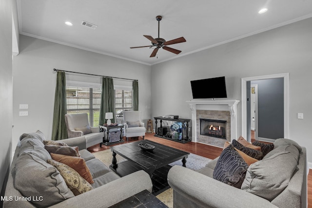101 Marion Dr, Clinton, MS 39056 - living room with ceiling fan, wood finished floors, a tile fireplace, ornamental molding, and recessed lighting