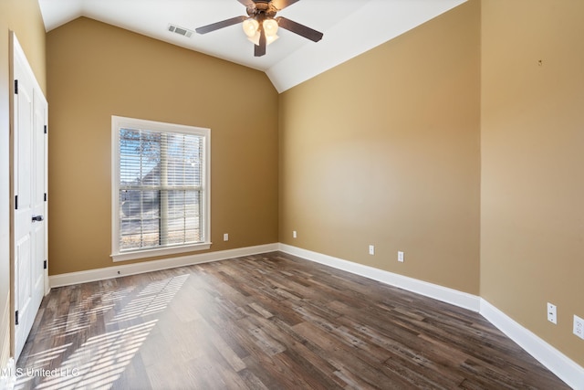 empty room featuring ceiling fan, dark wood-type flooring, and lofted ceiling