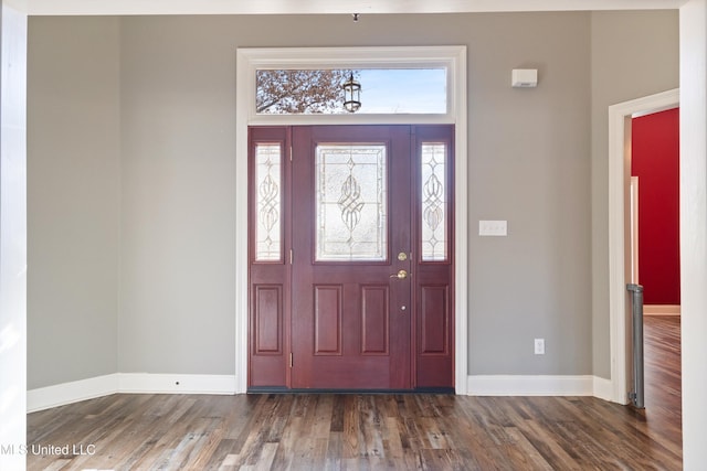 foyer with dark hardwood / wood-style floors