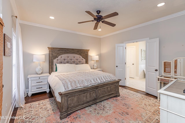 bedroom featuring dark hardwood / wood-style flooring, crown molding, and ceiling fan