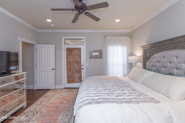 bedroom with dark wood-type flooring, ornamental molding, and ceiling fan