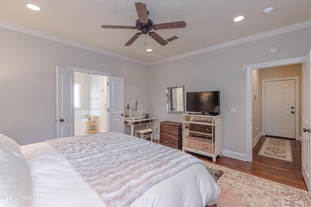 bedroom with crown molding, hardwood / wood-style floors, ceiling fan, and ensuite bath