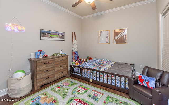 bedroom featuring crown molding, wood-type flooring, and ceiling fan