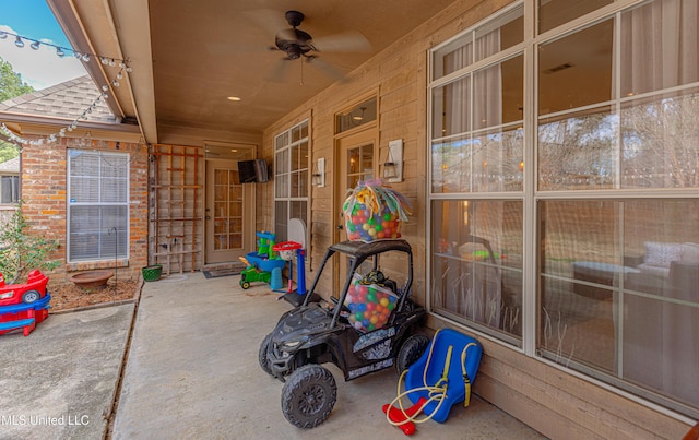 view of patio / terrace featuring ceiling fan