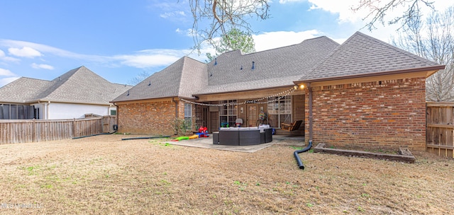 back of house featuring a patio area and outdoor lounge area