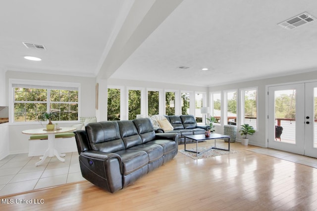 6085 Shawnee St, Kiln, MS 39556 - living room featuring healthy amount of natural light, french doors, baseboards, light wood-style flooring, and recessed lighting