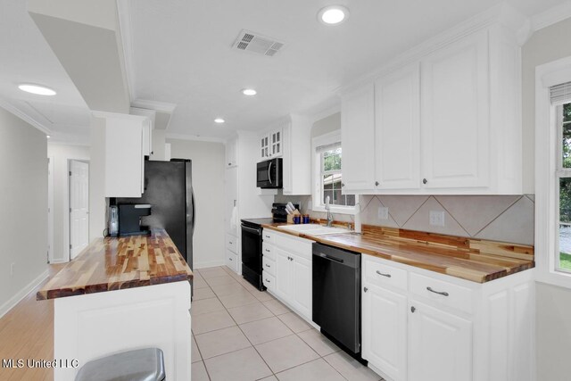 6085 Shawnee St, Kiln, MS 39556 - kitchen featuring black electric range oven, wooden counters, dishwashing machine, a sink, and recessed lighting