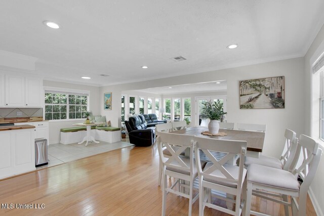 6085 Shawnee St, Kiln, MS 39556 - dining space with recessed lighting, crown molding, and light wood-type flooring