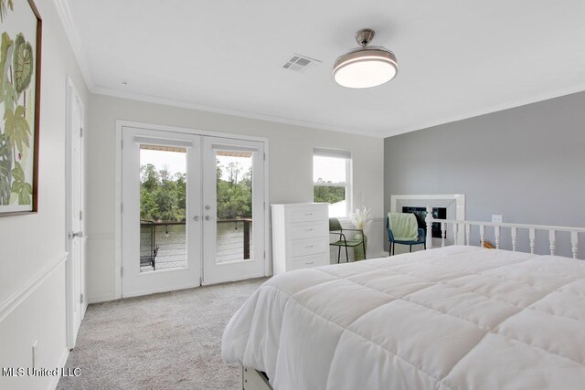6085 Shawnee St, Kiln, MS 39556 - carpeted bedroom featuring french doors, access to exterior, crown molding, and a water view