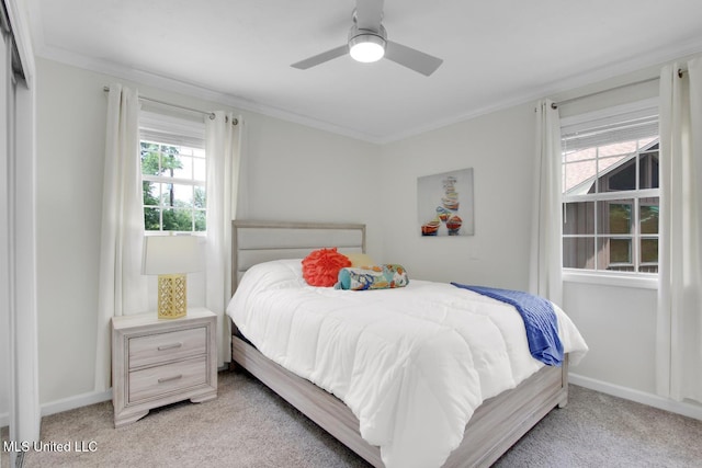 6085 Shawnee St, Kiln, MS 39556 - bedroom with light carpet, crown molding, a ceiling fan, and baseboards