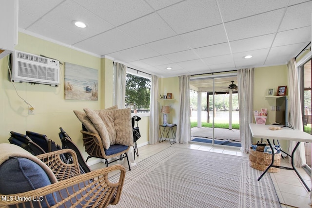 6085 Shawnee St, Kiln, MS 39556 - living area featuring tile patterned flooring, a wall mounted air conditioner, recessed lighting, and crown molding
